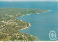 <span class="caption-caption">Aerial view of Pumicestone Channel and Bribie bridge</span>, 1975. <br />Postcard folder by <span class="caption-publisher">Bernard Kuskopf</span>, collection of <span class="caption-contributor">Centre for the Government of Queensland</span>.