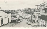 <span class="caption-caption">Upper Mary Streeet and Calton Hill, Gympie</span>, c1956. <br />Postcard folder by <span class="caption-publisher">Murray Views Pty Ltd</span>, collection of <span class="caption-contributor">Centre for the Government of Queensland</span>.