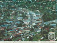 <span class="caption-caption">Aerial view showing Mary Street, the commercial centre of Gympie and the prosperous Mary Valley, Gympie</span>, c1980. <br />Postcard folder by <span class="caption-publisher">Murray Views Pty Ltd</span>, collection of <span class="caption-contributor">Centre for the Government of Queensland</span>.