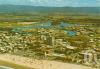 <span class="caption-caption">Aerial view of Surfers Paradise looking towards Springbrook</span>, c1968. <br />Postcard by <span class="caption-publisher">Sydney G. Hughes Pty Ltd</span>, collection of <span class="caption-contributor">Centre for the Government of Queensland</span>.