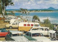 <span class="caption-caption">Board riders gather at entrance to the Noosa National Park</span>, c1963. <br />Postcard folder by <span class="caption-publisher">Bernard Kuskopf</span>, collection of <span class="caption-contributor">Centre for the Government of Queensland</span>.