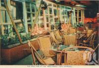 <span class="caption-caption">The open fire at the Boolarong Café Espresso, Alexandra Headland</span>, c1958. <br />Postcard folder by <span class="caption-publisher">Sydney G Hughes Pty Ltd</span>, collection of <span class="caption-contributor">Centre for the Government of Queensland</span>.