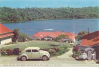 <span class="caption-caption">Water ski-ing Lake Barrine, showing dinng hall and tea room, Yungaburra</span>, c1960. <br />Postcard folder by <span class="caption-publisher">Murray Views Pty Ltd</span>, collection of <span class="caption-contributor">Centre for the Government of Queensland</span>.
