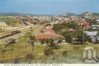 <span class="caption-caption">Railway marshalling yards and town from Auckland Hill, Gladstone</span>, c1960. <br />Postcard folder by <span class="caption-publisher">Murray Views Pty Ltd</span>, collection of <span class="caption-contributor">Centre for the Government of Queensland</span>.