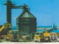 <span class="caption-caption">Mineral sand loading facilities at Dunwich, North Stradbroke Island</span>, c1962. <br />Postcard folder by <span class="caption-publisher">Murray Views Pty Ltd</span>, collection of <span class="caption-contributor">Centre for the Government of Queensland</span>.