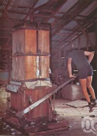 <span class="caption-caption">Pressing wool manually, Charleville</span>, c1980. <br />Postcard folder by <span class="caption-publisher">Murray Views Pty Ltd</span>, collection of <span class="caption-contributor">Centre for the Government of Queensland</span>.