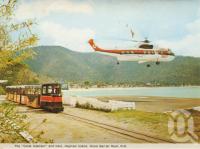 <span class="caption-caption">The 'Coral Islander' and train, Hayman Island, Great Barrier Reef</span>, 1975. <br />Postcard folder by <span class="caption-publisher">Murray Views Pty Ltd</span>, collection of <span class="caption-contributor">Centre for the Government of Queensland MS</span>.