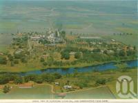 <span class="caption-caption">Aerial view of Pleystowe sugar mill and surrounding cane farms</span>, c1966. <br />Postcard folder by <span class="caption-publisher">Sydney G Hughes Pty Ltd</span>, collection of <span class="caption-contributor">Centre for the Government of Queensland MS</span>.