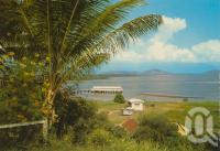 <span class="caption-caption">Overlooking the harbour, Port Douglas</span>, c1976. <br />Postcard by <span class="caption-publisher">Murray Views Pty Ltd</span>, collection of <span class="caption-contributor">Centre for the Government of Queensland</span>.