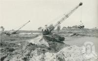 <span class="caption-caption">Excavating canals at Miami Keys Estate development</span>. <br />From <span class="caption-book">Gold Coast: The story of the Gold Coast of Queensland and Hinterland</span>, 1958, collection of <span class="caption-contributor">John Young</span>.