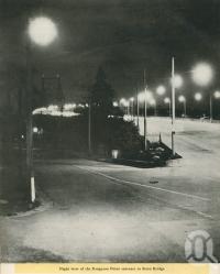 <span class="caption-caption">Night view of the Kangaroo Point entrance to Story Bridge</span>, 1949. <br />Booklet, collection of <span class="caption-contributor">John Young</span>.