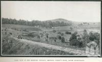 <span class="caption-caption">Farm view in the Marburg District, showing Perry's Knob</span>. <br />From <span class="caption-book">Glimpses of Sunny Queensland (3rd edition)</span>, <span class="caption-creator">Queensland Government Intelligence and Tourist Bureau</span>, Brisbane, 1914, collection of <span class="caption-contributor">Centre for the Government of Queensland</span>.