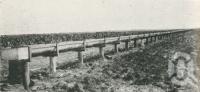 <span class="caption-caption">One and a half miles of irrigation fluming on Fairymead Sugar Plantation near Bundaberg, Burnett District</span>. <br />From <span class="caption-book">The Pocket Queensland</span>, <span class="caption-creator">Queensland Government Intelligence and Tourist Bureau</span>, Brisbane, 1921, collection of <span class="caption-contributor">Centre for the Government of Queensland</span>.