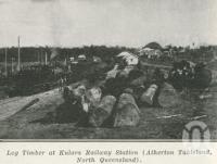 <span class="caption-caption">Log timber at Kulara Railway Station, Atherton Tableland</span>. <br />From <span class="caption-book">The Pocket Queensland</span>, <span class="caption-creator">Queensland Government Intelligence and Tourist Bureau</span>, Brisbane, 1921, collection of <span class="caption-contributor">Centre for the Government of Queensland</span>.