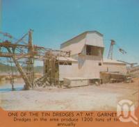 <span class="caption-caption">One of the tin dredges at Mount Garnet</span>. <br />From <span class="caption-book">Tropical Atherton Tableland</span>, <span class="caption-creator">Tableland Tourist Association</span>, c1970, collection of <span class="caption-contributor">Centre for the Government of Queensland</span>.
