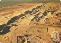 <span class="caption-caption">Aerial view featuring an open cut coal mine, Moranbah</span>, c1970-2000. <br />Postcard, collection of <span class="caption-contributor">Murray Views Collection</span>.