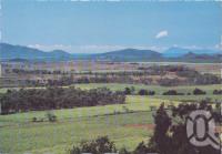 <span class="caption-caption">From Mt Jukes Lookout across a valley 9of canefields to the sea.  Brampton Island is in the background, Seaforth</span>, c1970-2000. <br />Postcard, collection of <span class="caption-contributor">Murray Views Collection</span>.