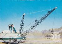 <span class="caption-caption">Goonyella Dragline, the giant 2,270,000 kilograms (2276.6 tonnes) dragline with a capacity of 48.96 cubic metres, removing the overburden from the Open Cut Coal Mine, Moranbah</span>, c1970-2000. <br />Postcard, collection of <span class="caption-contributor">Murray Views Collection</span>.