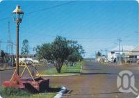 <span class="caption-caption">Landsborough Street showing the original town well constructed in the 1880s - the first permanent water supply, Normanton</span>, c1970-2000. <br />Postcard, collection of <span class="caption-contributor">Murray Views Collection</span>.