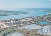 <span class="caption-caption">Aerial view of the Norman River and gulf prawning town of Karumba, looking towards the Gulf of Carpentaria, 1980, Karumba</span>, c1970-2000. <br />Postcard, collection of <span class="caption-contributor">Murray Views Collection</span>.