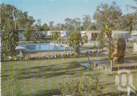<span class="caption-caption">Features swimming pool, open lawns and a natural sandstone rock from the Moura Open Cut Mine, containing three different pieces of petrified wood, weighing approximately three tonnes, "Dawson Valley" Caravan park, Moura</span>, c1970-2000. <br />Postcard, collection of <span class="caption-contributor">Murray Views Collection</span>.