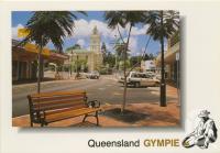 <span class="caption-caption">Mary Street looking south towards the Town Hall, Gympie, photograph by Rod Murray</span>, c1990. <br />Postcard by <span class="caption-publisher">Murray Views Pty Ltd</span>, collection of <span class="caption-contributor">Centre for the Government of Queensland</span>.