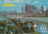 <span class="caption-caption">The Captain Cook Bridge and city skyline, Brisbane</span>, c1980. <br />Postcard by <span class="caption-publisher">Murray Views Pty Ltd</span>, collection of <span class="caption-contributor">Centre for the Government of Queensland</span>.