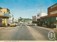 <span class="caption-caption">Goondoon Street, Gladstone</span>, c1975. <br />Postcard folder by <span class="caption-publisher">Murray Views Pty Ltd</span>, collection of <span class="caption-contributor">Centre for the Government of Queensland</span>.