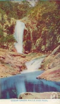 <span class="caption-caption">Cedar Creek Falls and pool</span>, c1938. <br />Postcard folder by <span class="caption-publisher">Brisbane Postcards</span>, collection of <span class="caption-contributor">Centre for the Government of Queensland</span>.