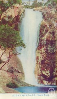 <span class="caption-caption">Cedar Creek Falls - main falls</span>, c1938. <br />Postcard folder by <span class="caption-publisher">Brisbane Postcards</span>, collection of <span class="caption-contributor">Centre for the Government of Queensland</span>.