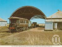 <span class="caption-caption">The rail motor operating between Normanton and Croydon at the Normanton Station</span>, c1983. <br />Postcard folder by <span class="caption-publisher">Murray Views Pty Ltd</span>, collection of <span class="caption-contributor">Centre for the Government of Queensland</span>.