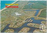 <span class="caption-caption">Aerial view of Kawana featuring the Marina, the Shopping Centre and the surfing beach, Kawana Waters</span>, c1970-2000. <br />Postcard, collection of <span class="caption-contributor">Murray Views Collection</span>.